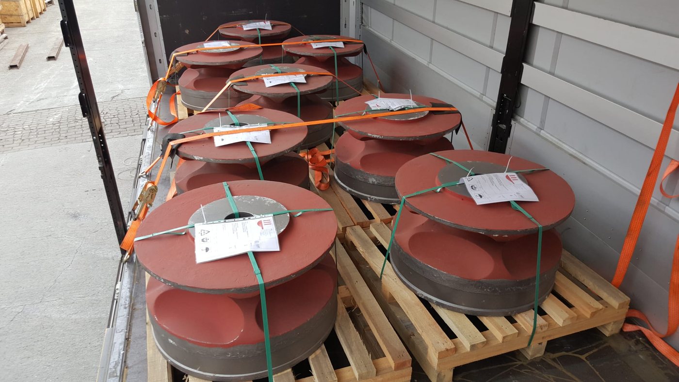 Primed round components tagged and strapped on pallets
