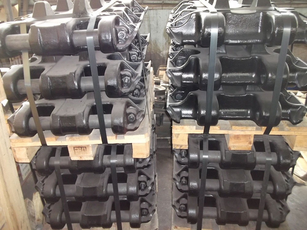 Finished track shoes stacked on pallets