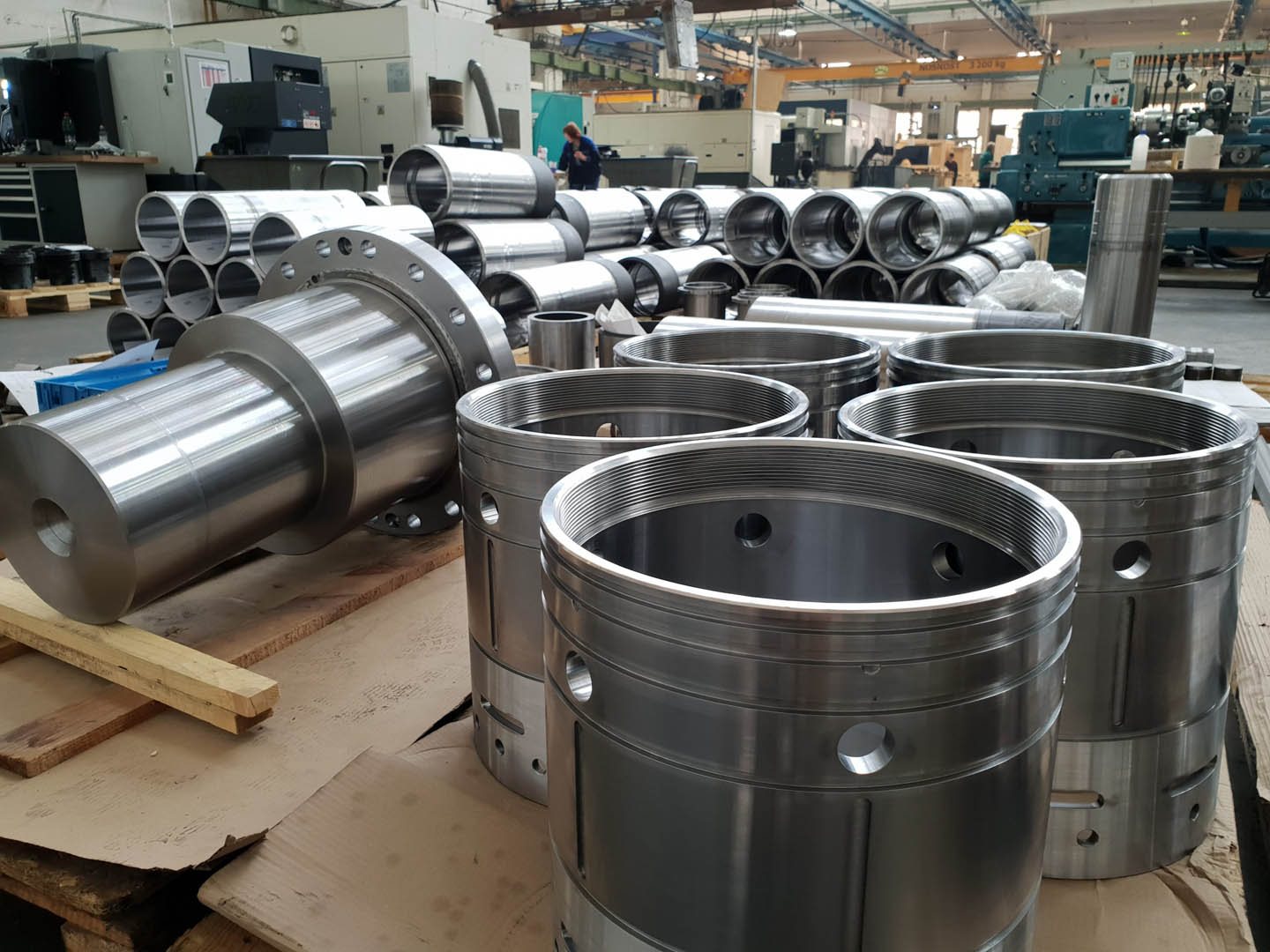 Batch of machined cylindrical components staged on the shop floor